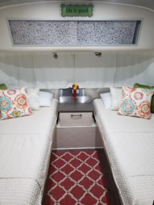 Final product Airstream Twin Bed Transformation.  Two bed Airstream beds with decorative pillows. 