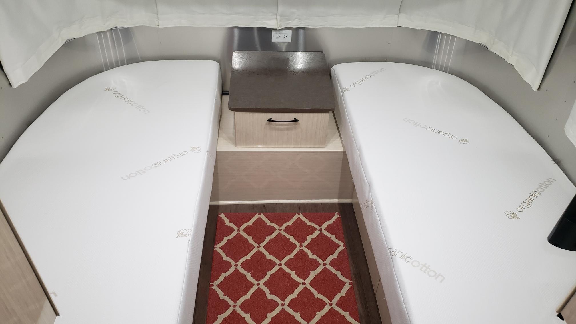 Image of two twin mattresses in an Airstream.